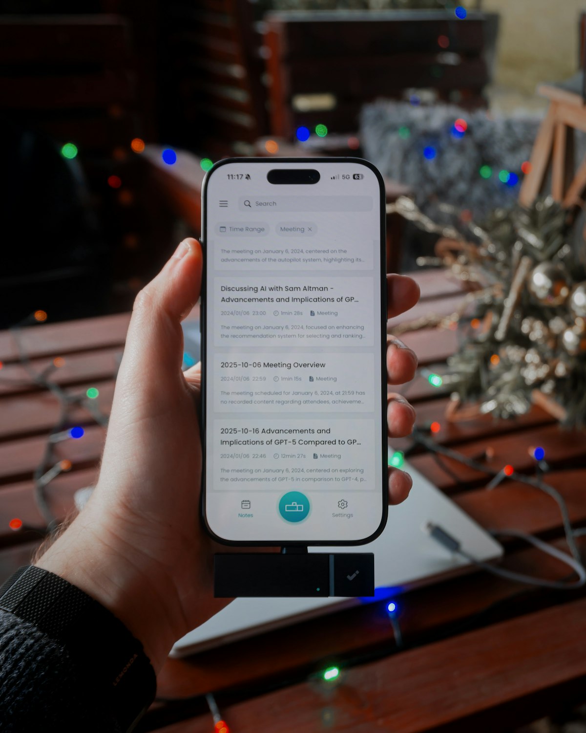 Hand holding smartphone demonstrating an AI voice agent for local business